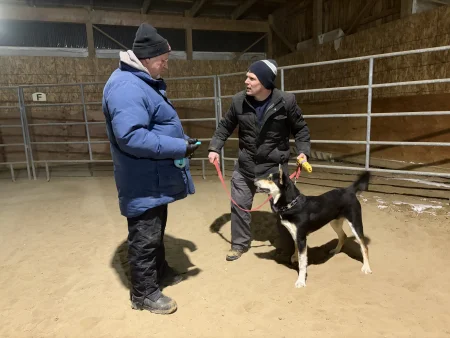 Dog training student expressively looks at the instructor